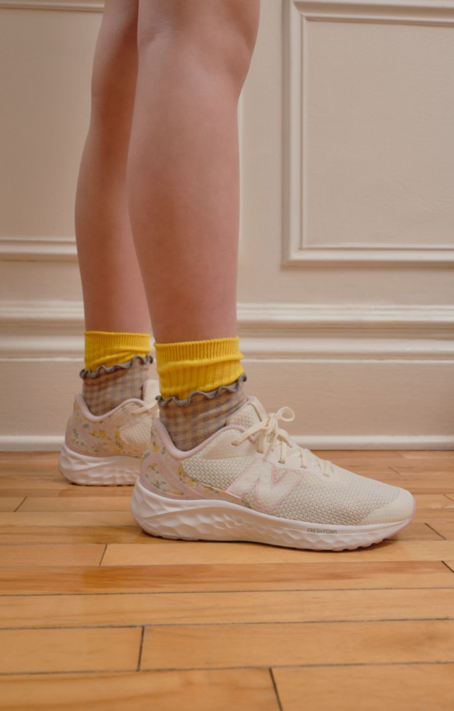 Close up of a child wearing new balance fresh foam x Arishi v4 running shoes